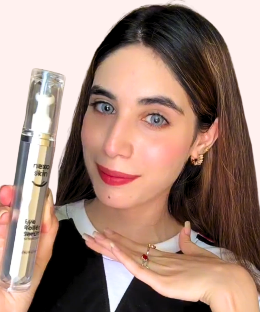Woman holding a cosmetic product "Nexo Skin Care Eye Roller Serum" with a plain background